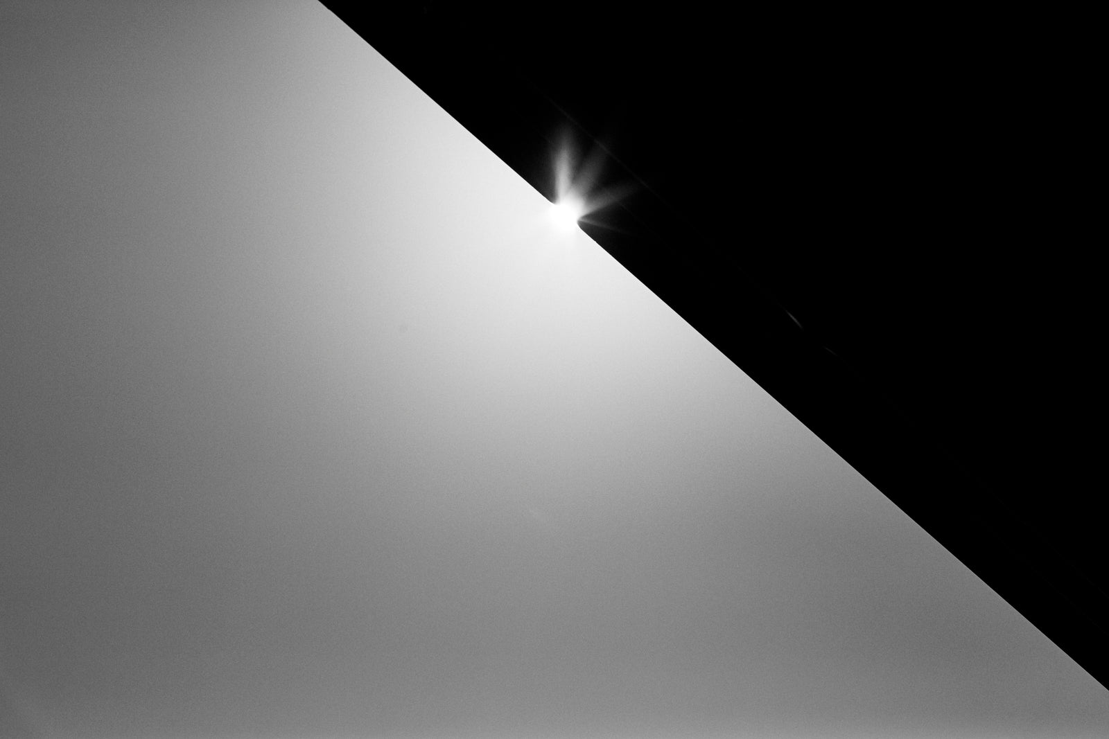 A diagonal of light across a dark frame